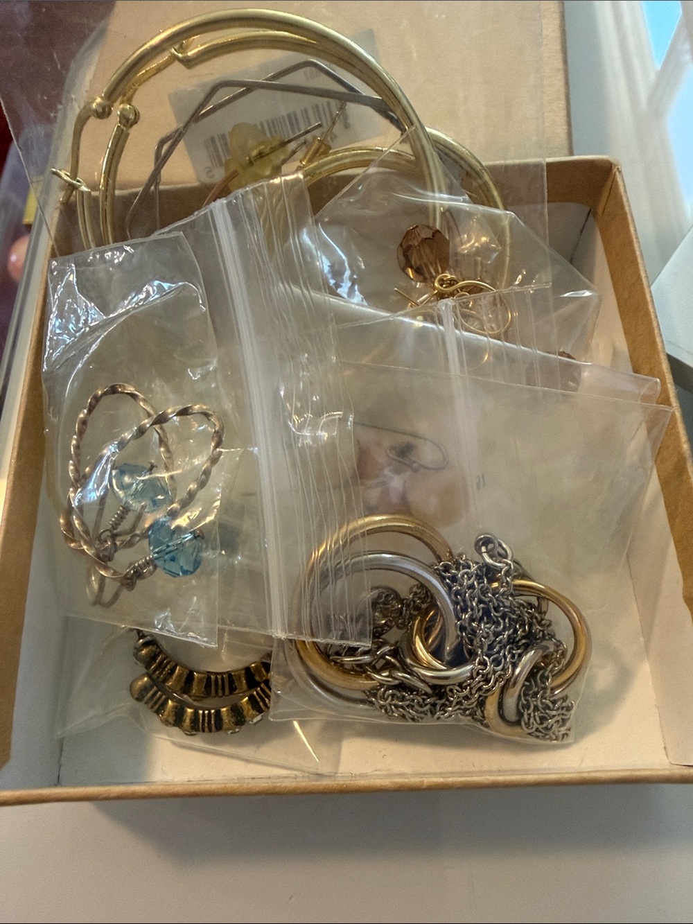 Mixed Gold and Silver box of fun jewelry